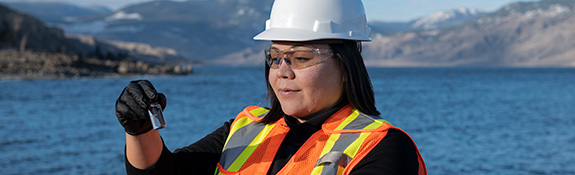 IR-2-female-worker-taking-water-sample-outside